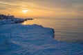 Blocks of ice on the seashore at sunset Royalty Free Stock Photo