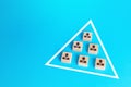 Blocks of people are joined together in a triangle. Combining efforts to achieve goal. Business team formation. Functioning Royalty Free Stock Photo