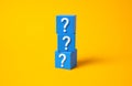 Blocks with question marks. Uncertainty, riddles and secrets. Ambiguity, lack of clear answers Royalty Free Stock Photo