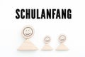 Blocks symbolizing parent with kids and the German sentence `Back to School`