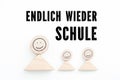 Blocks symbolizing parent with kids and the sentence `Back to School, finally ` in German