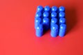 Buildable colored plastic blocks to play, build and organize on a red background as a concept of inclusion, diversity and pluralit Royalty Free Stock Photo