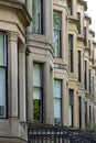 Terrace of Victorian tenement buildings built of sandstone in Glasgow`s West End, Scotland UK.