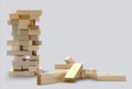 Blocks wood game jenga on gray background. Royalty Free Stock Photo