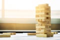 the blocks wood tower game with architectural engineer plans or Royalty Free Stock Photo