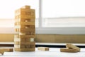 the blocks wood tower game with architectural engineer plans or Royalty Free Stock Photo