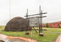 Information board and Zulu hut at the Ncome Zulu Museum Royalty Free Stock Photo