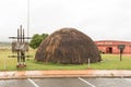 Visitors parking and Zulu hut at the Ncome Zulu Museum Royalty Free Stock Photo