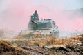 Rooikat armoured reconnaissance vehicle driving through muddy water