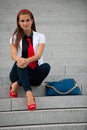 Blog style fashionable woman on stairs posing
