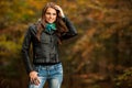 Blog style pretty young woman on a walk in forest on late autumn Royalty Free Stock Photo