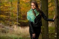 Blog style pretty young woman on a walk in forest on late autumn Royalty Free Stock Photo