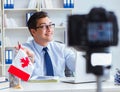 Blogger doing webcast on canadian immigration to Canada Royalty Free Stock Photo