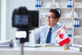 The blogger doing webcast on canadian immigration to canada Royalty Free Stock Photo