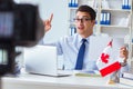 The blogger doing webcast on canadian immigration to canada Royalty Free Stock Photo