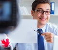 Blogger doing webcast on canadian immigration to Canada Royalty Free Stock Photo