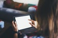 Blogger girl person holding computer with blank screen on background bokeh, hipster girl using tablet technology in home, female Royalty Free Stock Photo