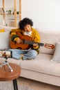 Blogger guitarist. Happy african american girl blogger playing guitar singing song recording vlog. Social media Royalty Free Stock Photo