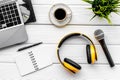 Blogger, journalist or musician office desk with computer keyboard, notebook, microphone and headphones on white