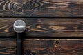 Blogger, journalist or musician office desk with microphone on wooden background top view copyspace