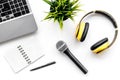 Blogger, journalist office with laptop, notebook, microphone and headphones white background top view copyspace Royalty Free Stock Photo