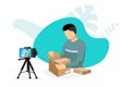 Blogger making video parcel unpacking content on camera with tripod. Man unboxing cardboard purchase streaming. Product
