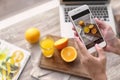 Blogger taking photo of food with mobile phone, closeup Royalty Free Stock Photo