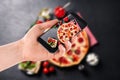 Blogger Taking Picture Of Delicious Pepperoni Pizza At Table. Food Photography