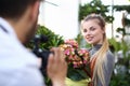 Blogger Woman Recording Pink Flower on Camera Royalty Free Stock Photo