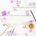 Blogger workspace with clipboard, notebook, pink flowers and accessories on rustic wooden background. Beauty blog concept with cop Royalty Free Stock Photo