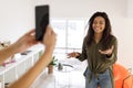 Cheerful black woman filming video on cellphone Royalty Free Stock Photo