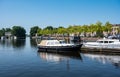 Blokzijl, Overijssel, The Netherlands, Pleasure harbor and banks of the canal against blue sky