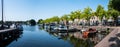 Blokzijl, Overijssel, The Netherlands, Pleasure harbor and banks of the canal against blue sky Royalty Free Stock Photo