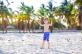 Blond adorable gorgeous little kid boy having fun on Miami beach, Key Biscayne. Happy healthy cute child playing with Royalty Free Stock Photo