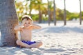 Blond adorable gorgeous little kid boy having fun on Miami beach, Key Biscayne. Happy healthy cute child playing with Royalty Free Stock Photo