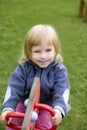 Blond adorable little girl playing playground Royalty Free Stock Photo