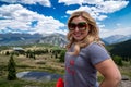 Blond adult woman poses at Molas Pass along the Million Dollar Highway in the San Juan Mountains of Colorado USA Royalty Free Stock Photo