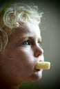Blond baby girl eating corn flakes Royalty Free Stock Photo