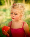 Blond baby girl eating water melon Royalty Free Stock Photo