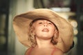 Blond baby girl with summer hat on the beach Royalty Free Stock Photo