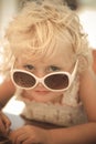 Blond baby girl with sun glasses Royalty Free Stock Photo