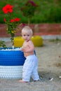 Blond baby on the beach with Hibiscus Royalty Free Stock Photo