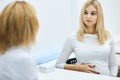 Blond beautiful pregnant girl asking advise to a talented therapist Royalty Free Stock Photo