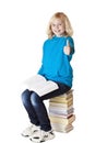 Blond, beautiful young schoolgirl shows thumb Royalty Free Stock Photo