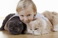 Blond boy with cats