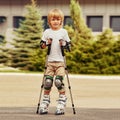 Blond Boy learning rollerblading Royalty Free Stock Photo