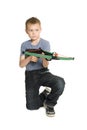 Blond boy shooting a crossbow Royalty Free Stock Photo