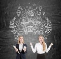 Blond business twins and a good idea Royalty Free Stock Photo