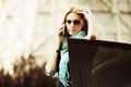 Fashion business woman calling on cell phone by her car Royalty Free Stock Photo