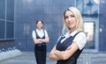 A blond businesswoman in front of her colleague Royalty Free Stock Photo